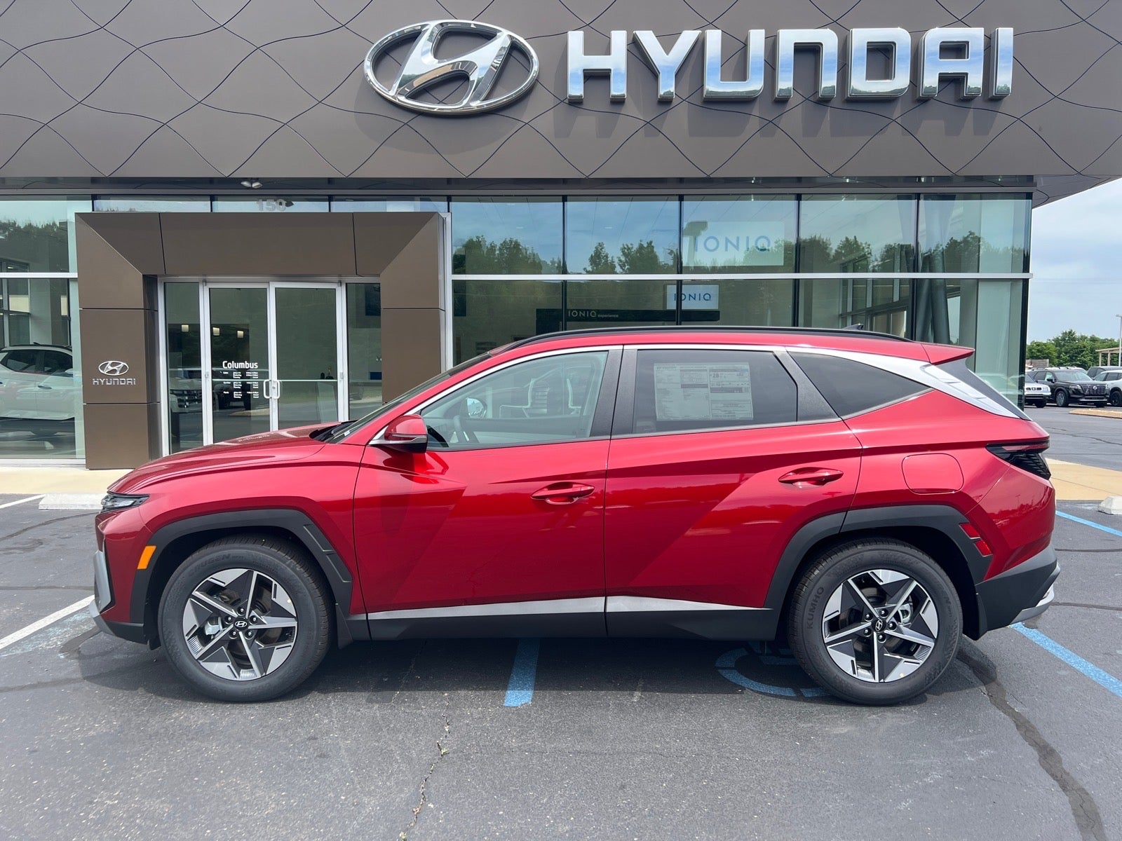 2026 Hyundai TUCSON SEL Premium in Red — front three-quarter view