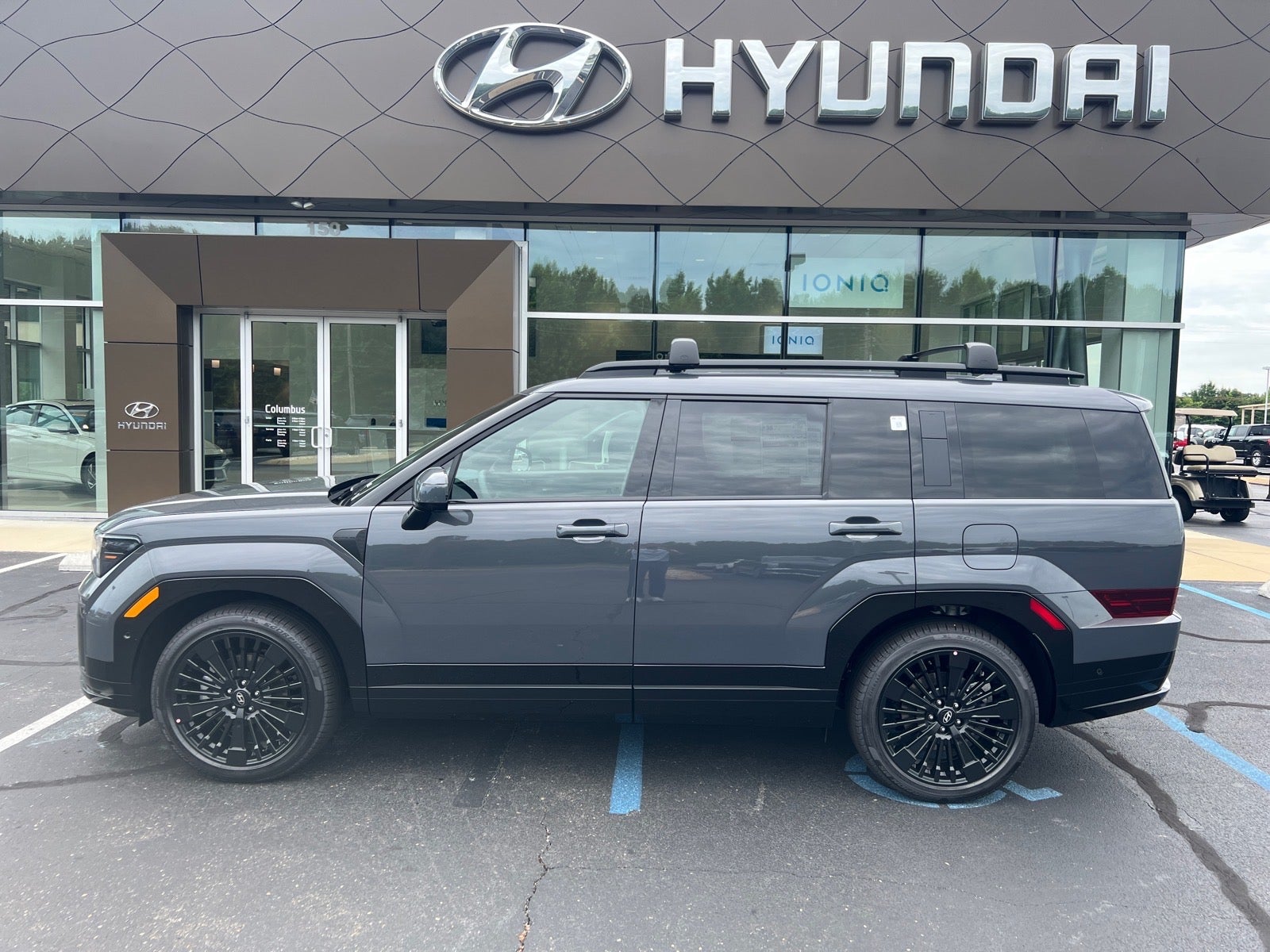 2026 Hyundai SANTA FE HYBRID Calligraphy in Gray — front three-quarter view