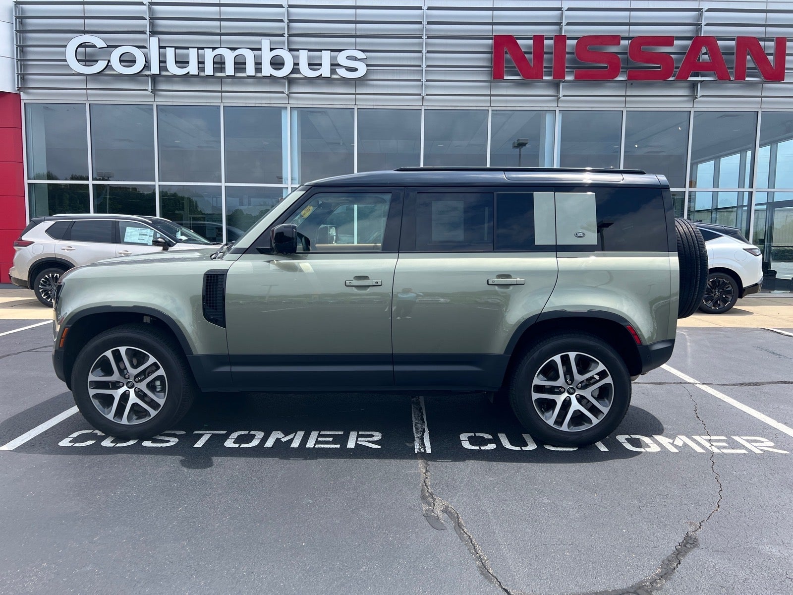 2023 Land Rover Defender 110S in Beige — front three-quarter view
